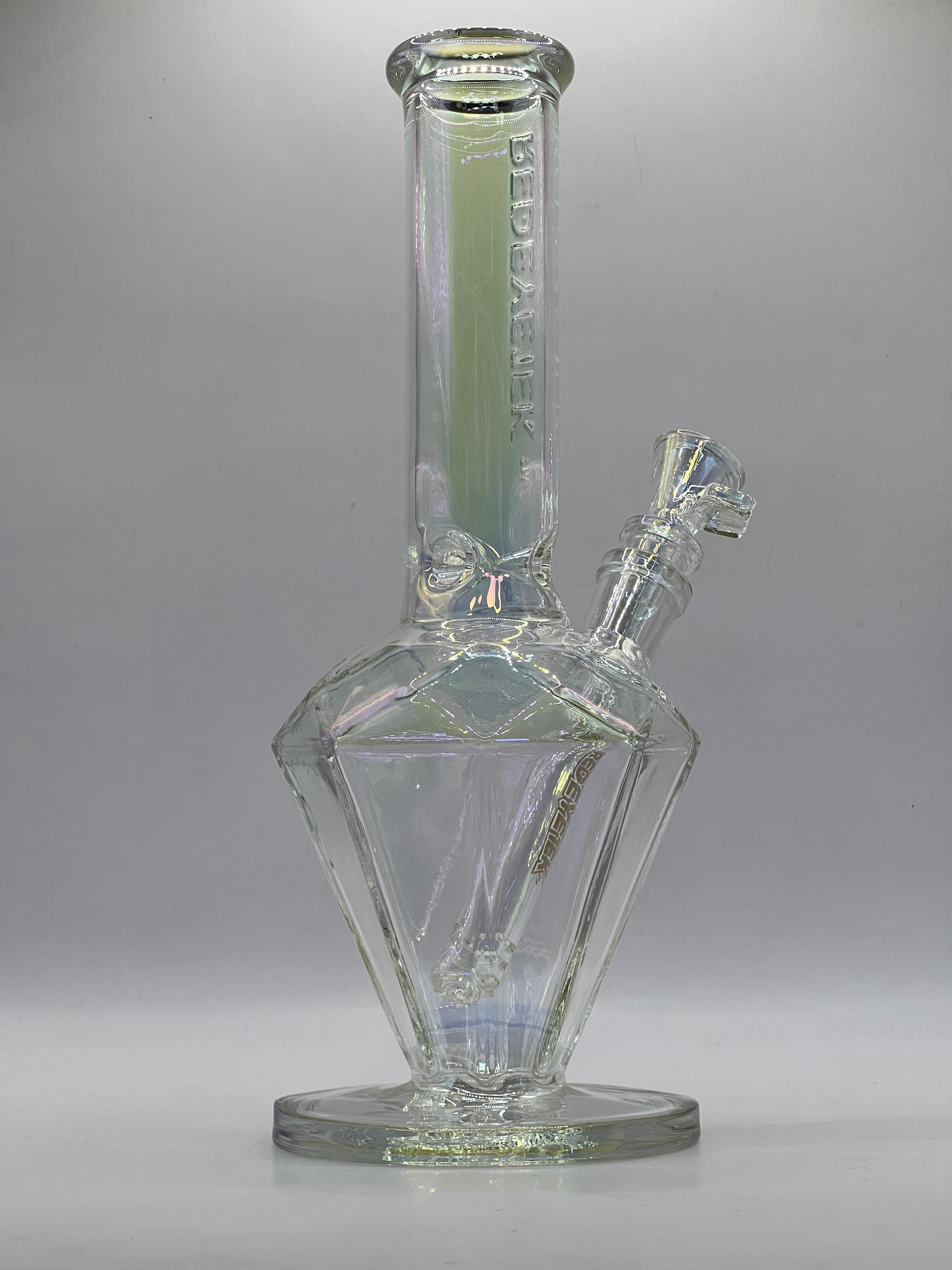 Angled studio view showing the faceted diamond chamber
