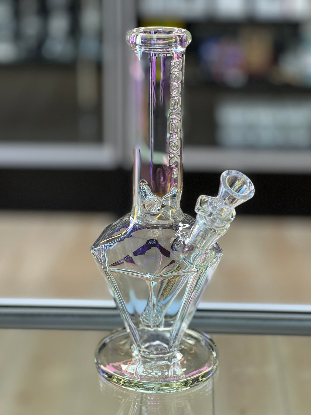 Red Eye Tek Paragon water pipe displayed inside Hex Smoke Shop