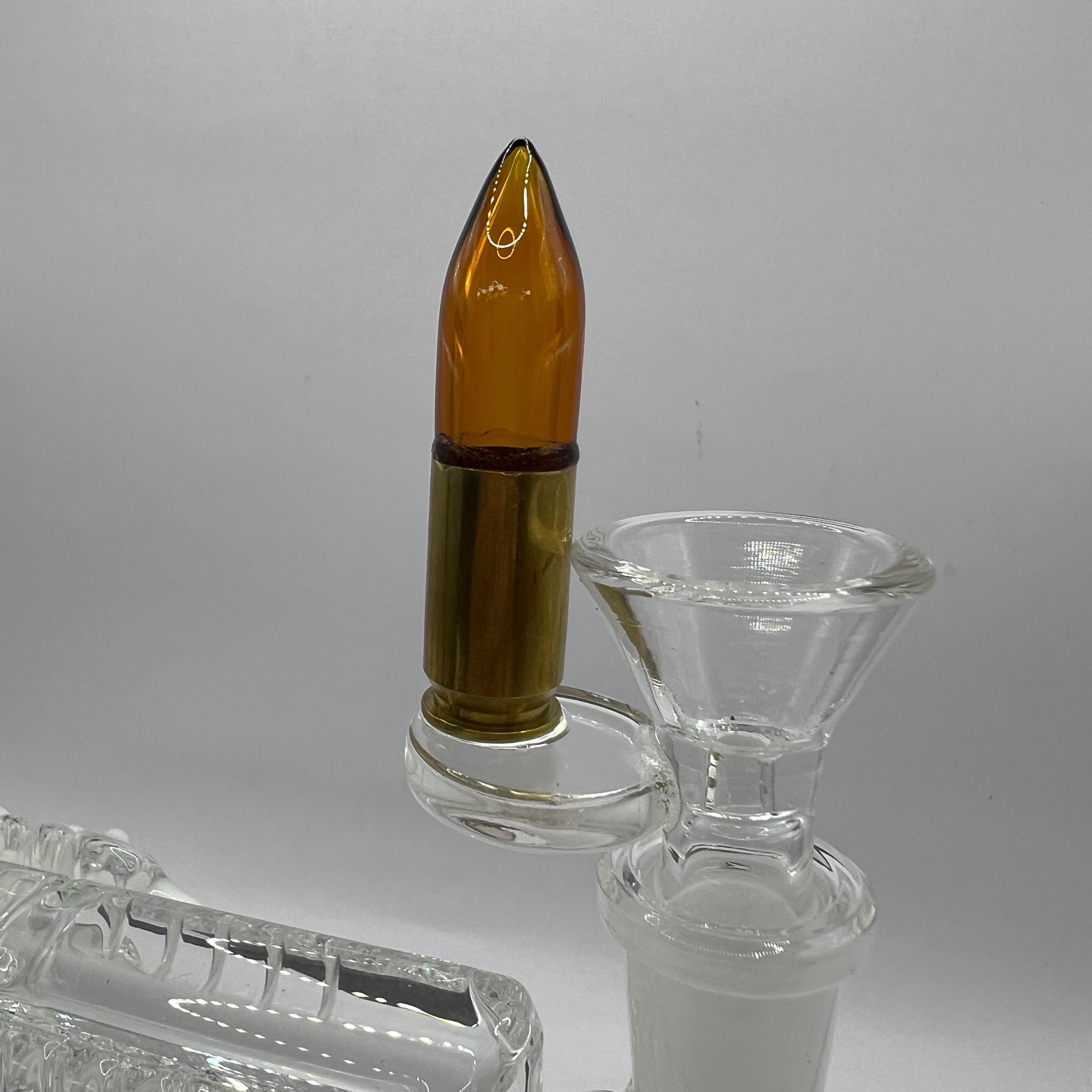 Custom removable 14mm glass .45 caliber cartridge bowl featuring brass-colored casing and amber glass bullet tip.