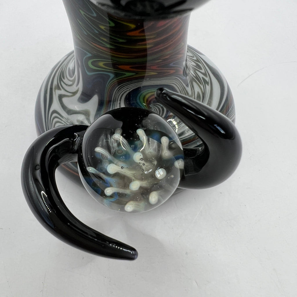 Close-up of black horn accents surrounding encased marble