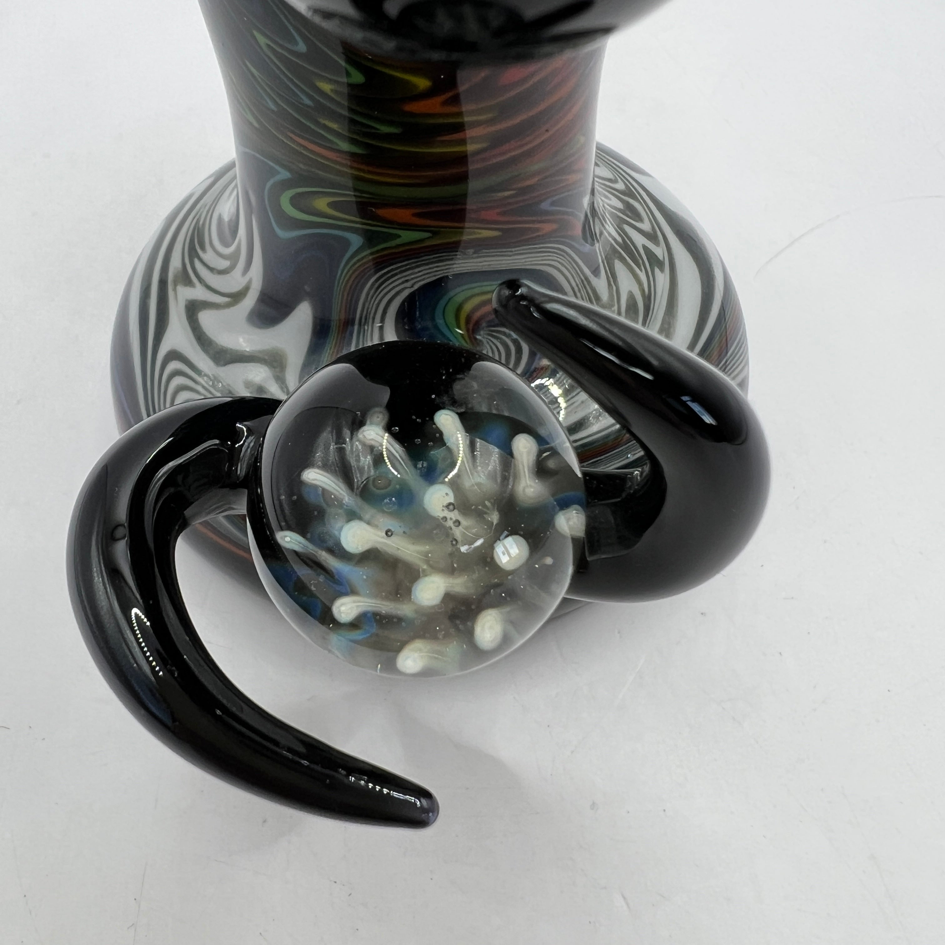 Close-up of black horn accents surrounding encased marble