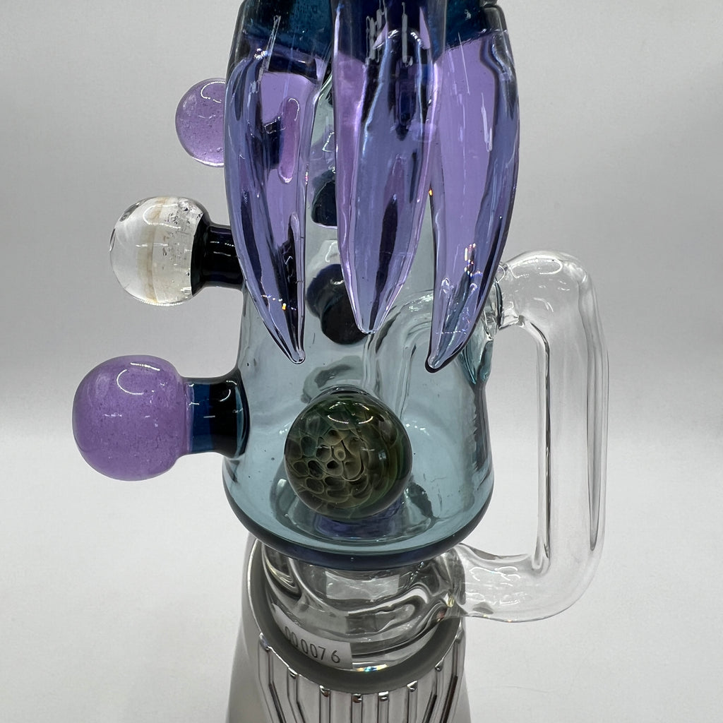 Close-up of Cthulhu sculpted glass details and marbles