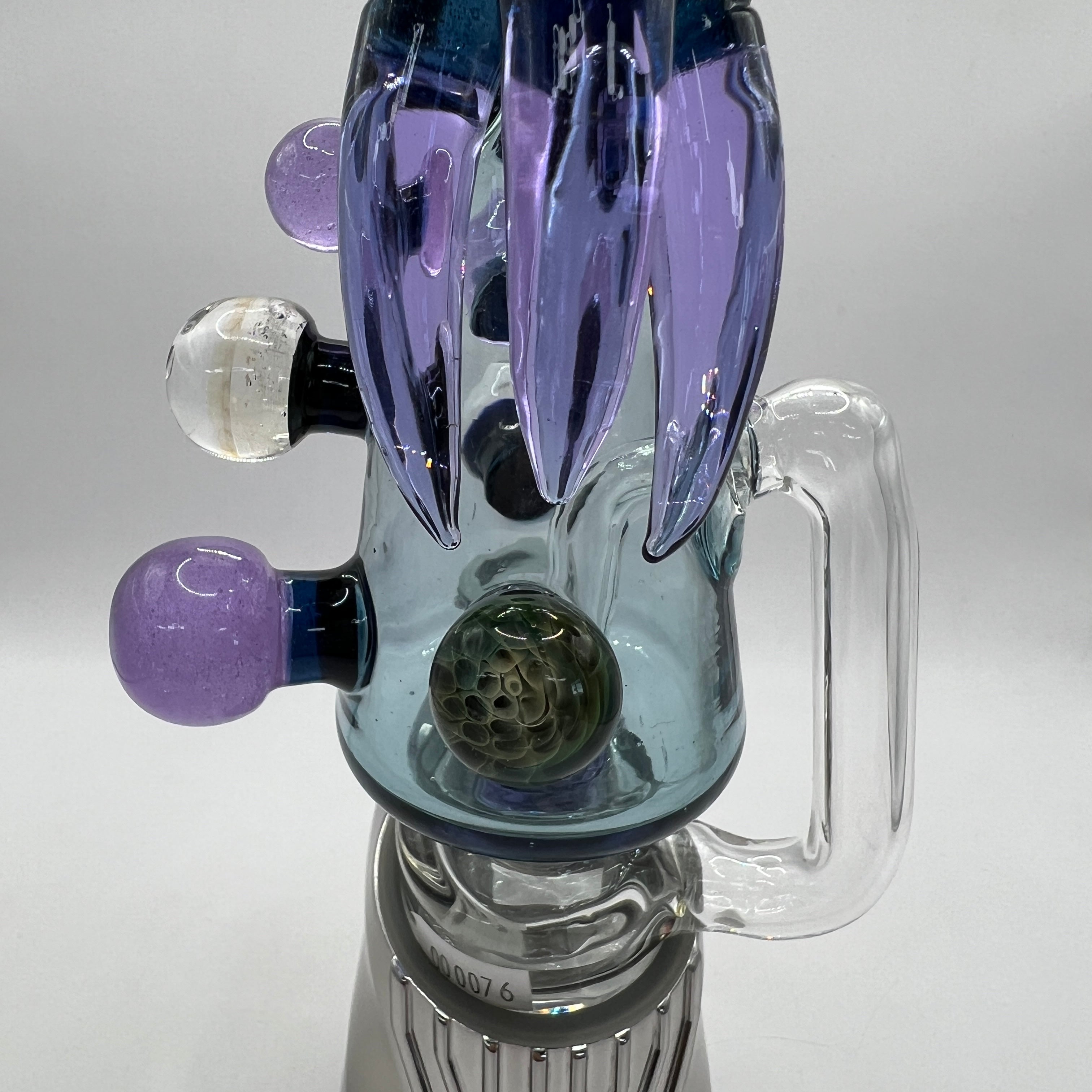 Close-up of Cthulhu sculpted glass details and marbles
