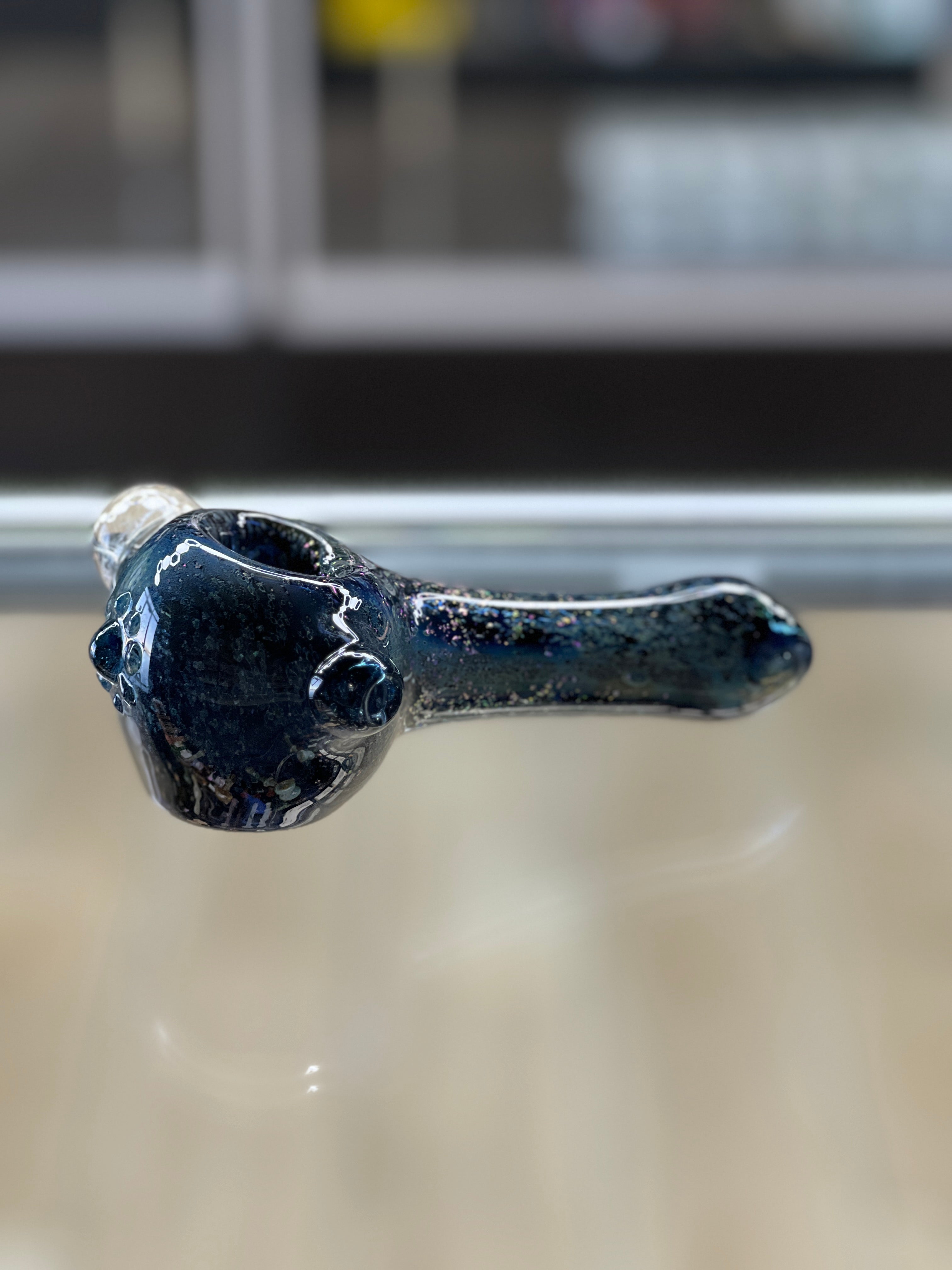 inside-Out Chaos glass spoon pipe with dot work and tapered mouthpiece"