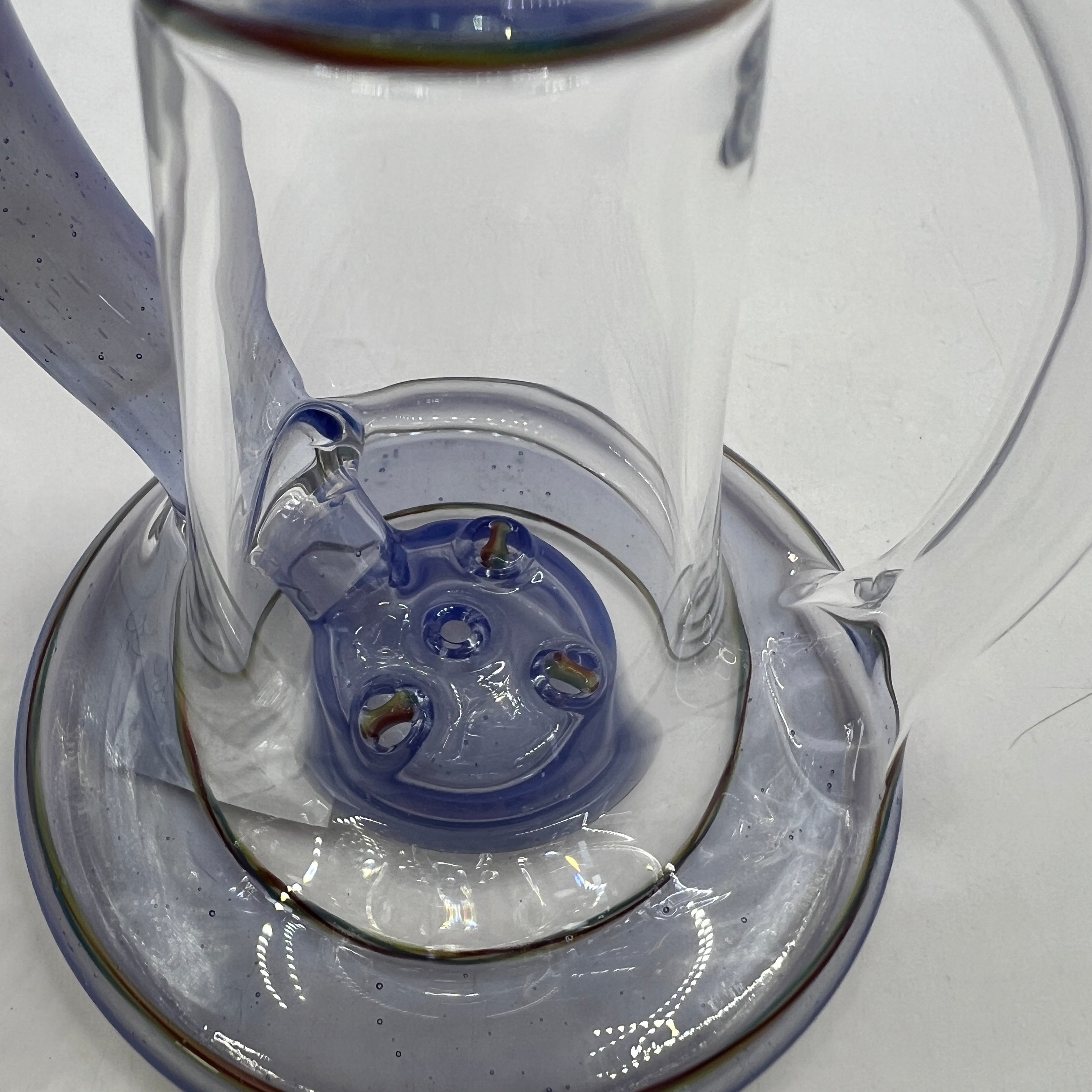 Close-up of four-hole puck percolator inside OM Glass recycler