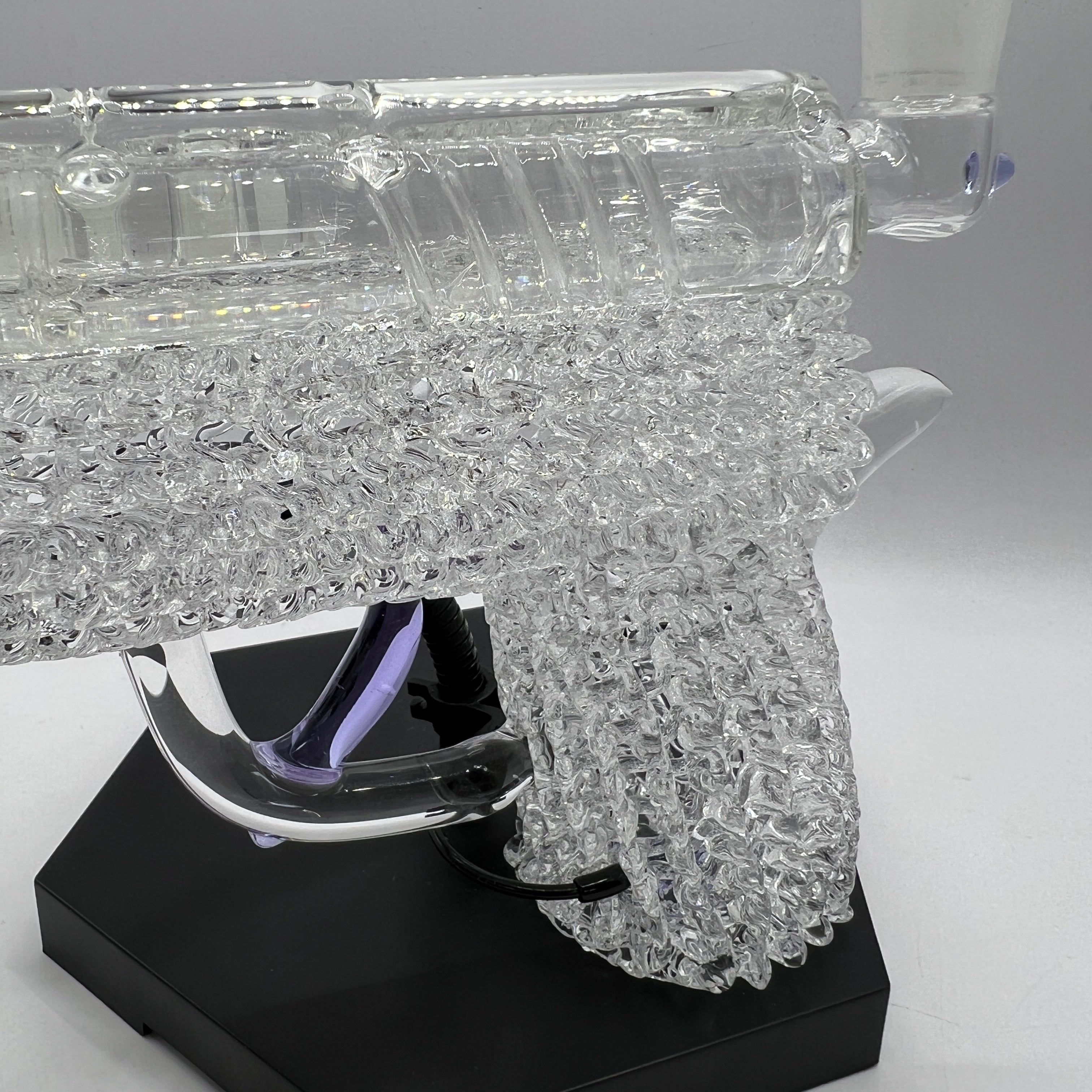 Macro view of the intricate clear chaos texture handcrafted into the OTG Glass collector handgun pipe.