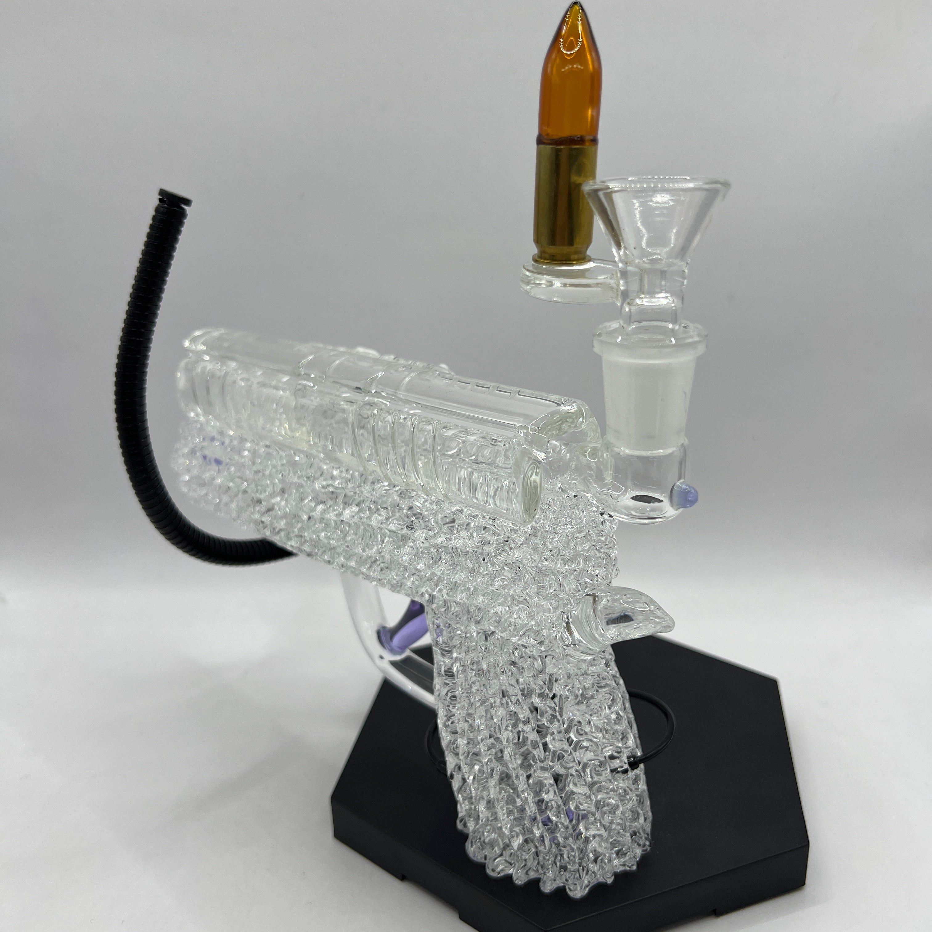 Detailed view of the textured glass grip and handcrafted chaos pattern on the OTG Glass collector handgun pipe.