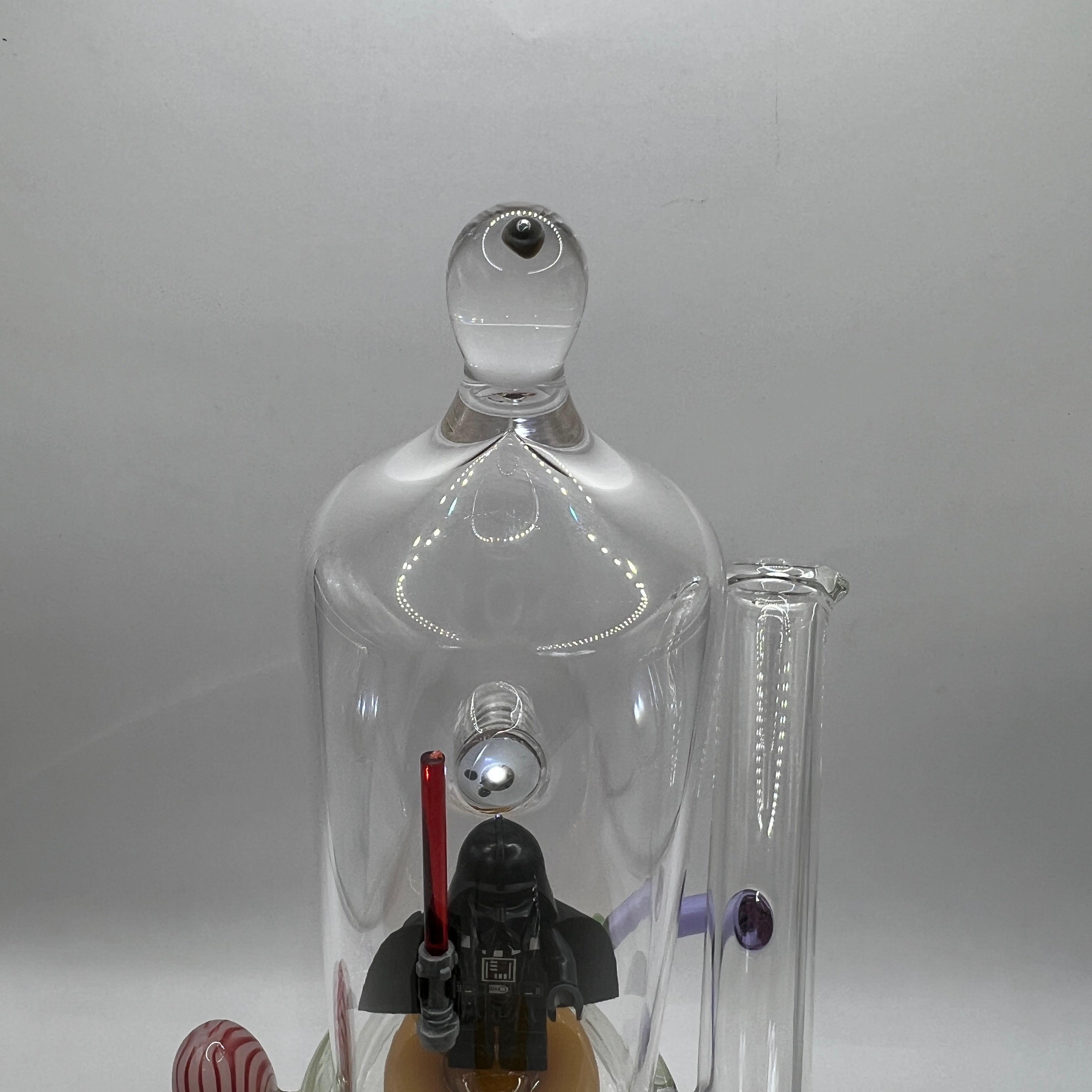Three-quarter front view of OTG Glass Darth Vader themed collector water pipe
