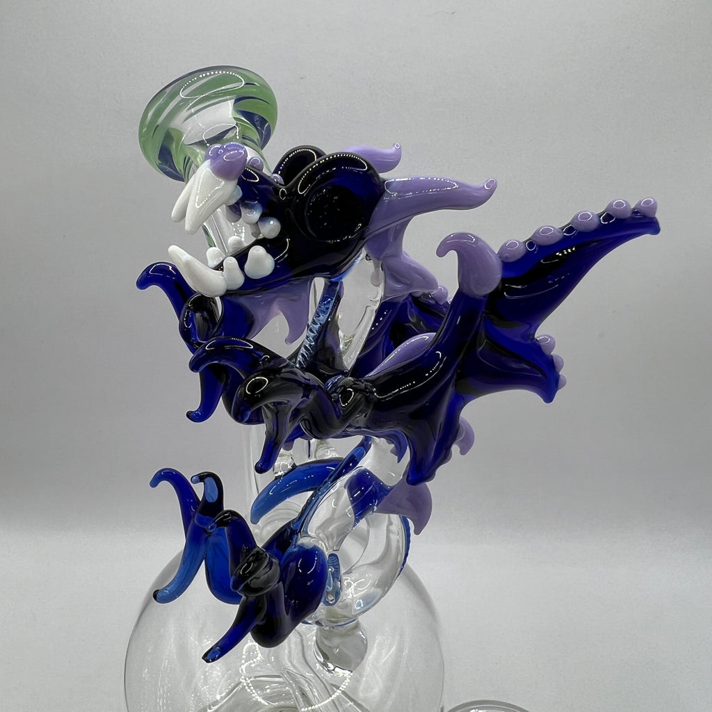 Detailed handcrafted dragon sculpture featuring wings, horns, scales, and fangs