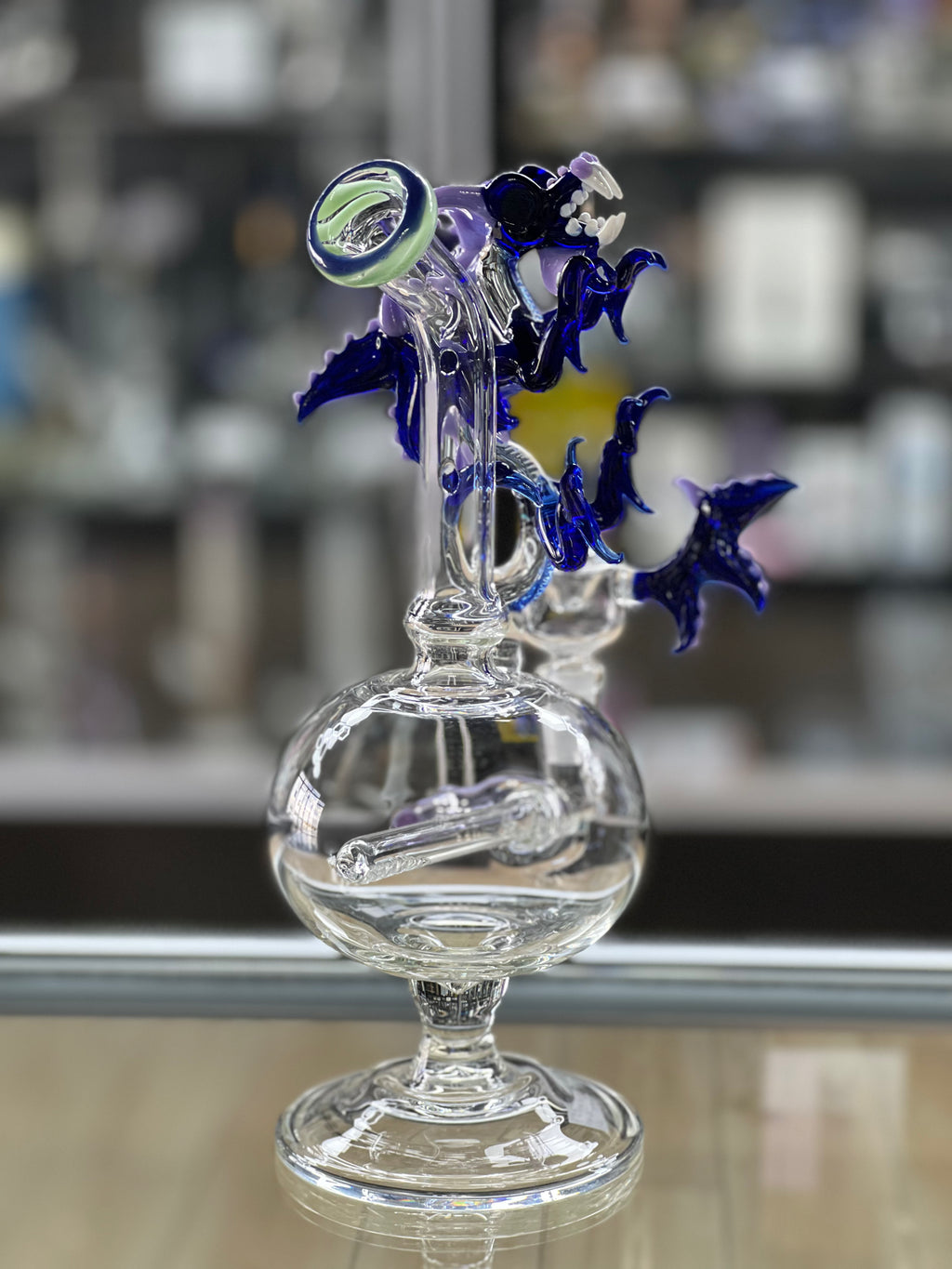 angled view of the otg glass dragon water pipe at hex smoke shop