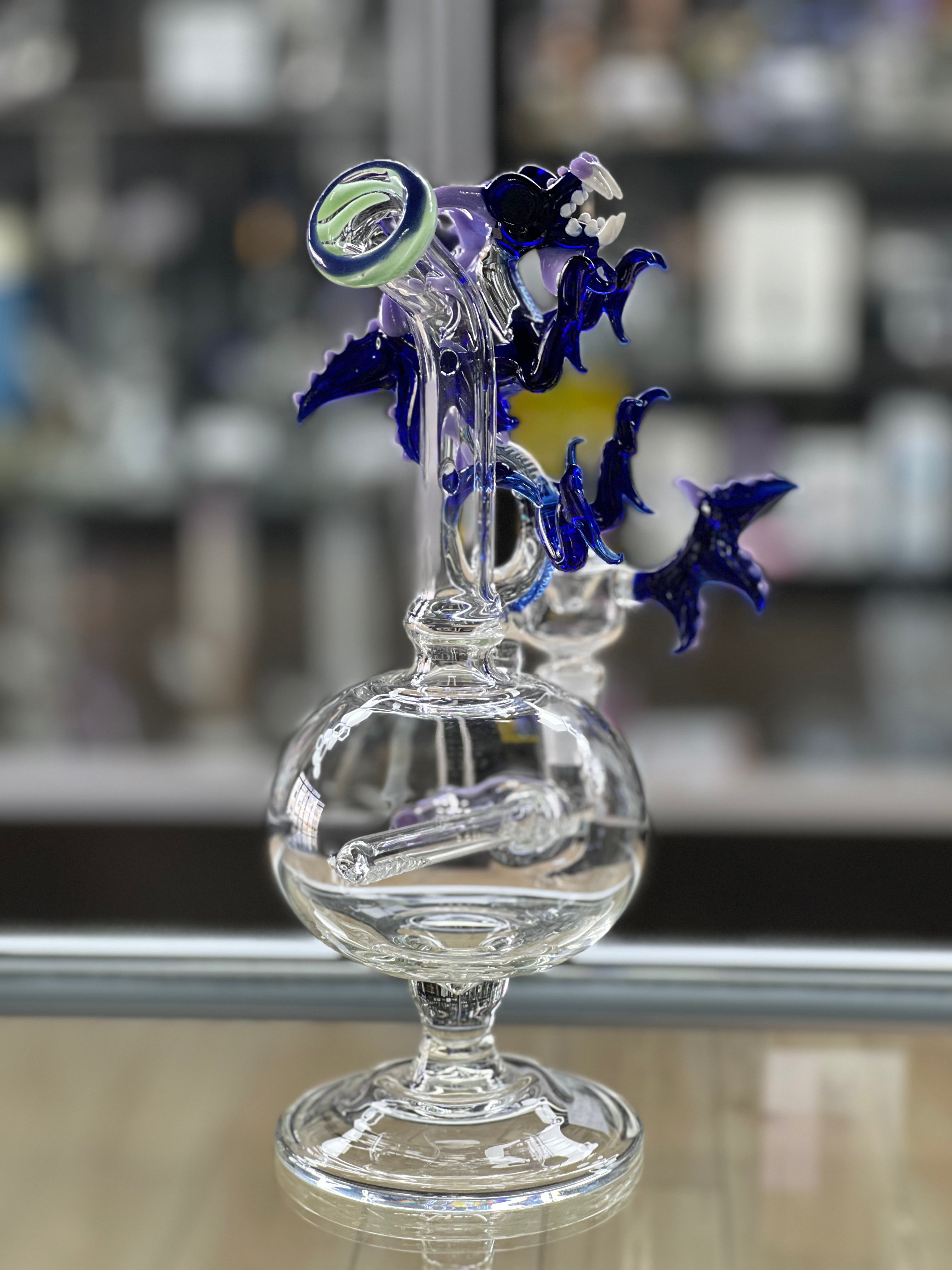 angled view of the otg glass dragon water pipe at hex smoke shop