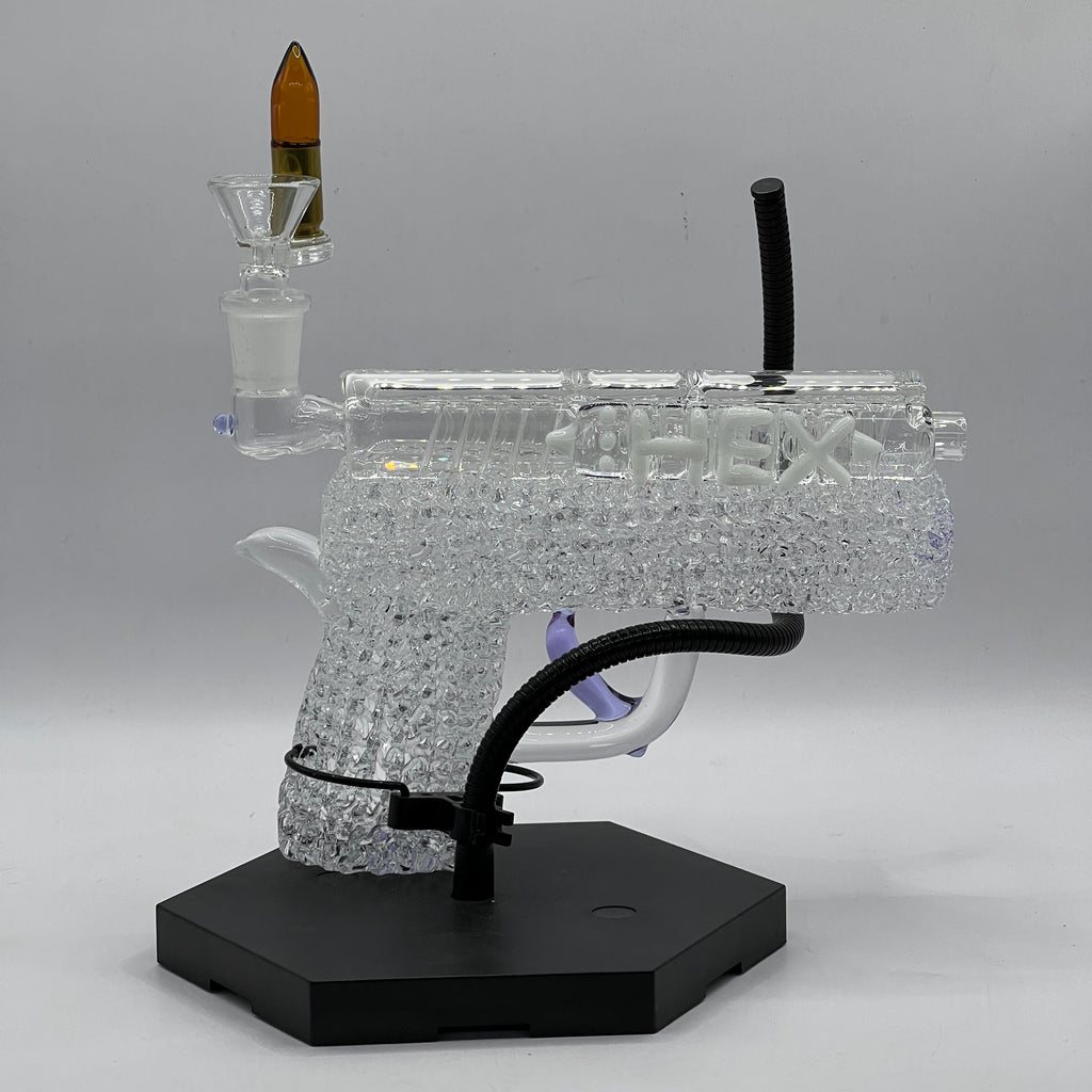 Opposite profile of OTG Glass collector handgun pipe showcasing sculpted slide, textured grip, and crystal-clear borosilicate craftsmanship.
