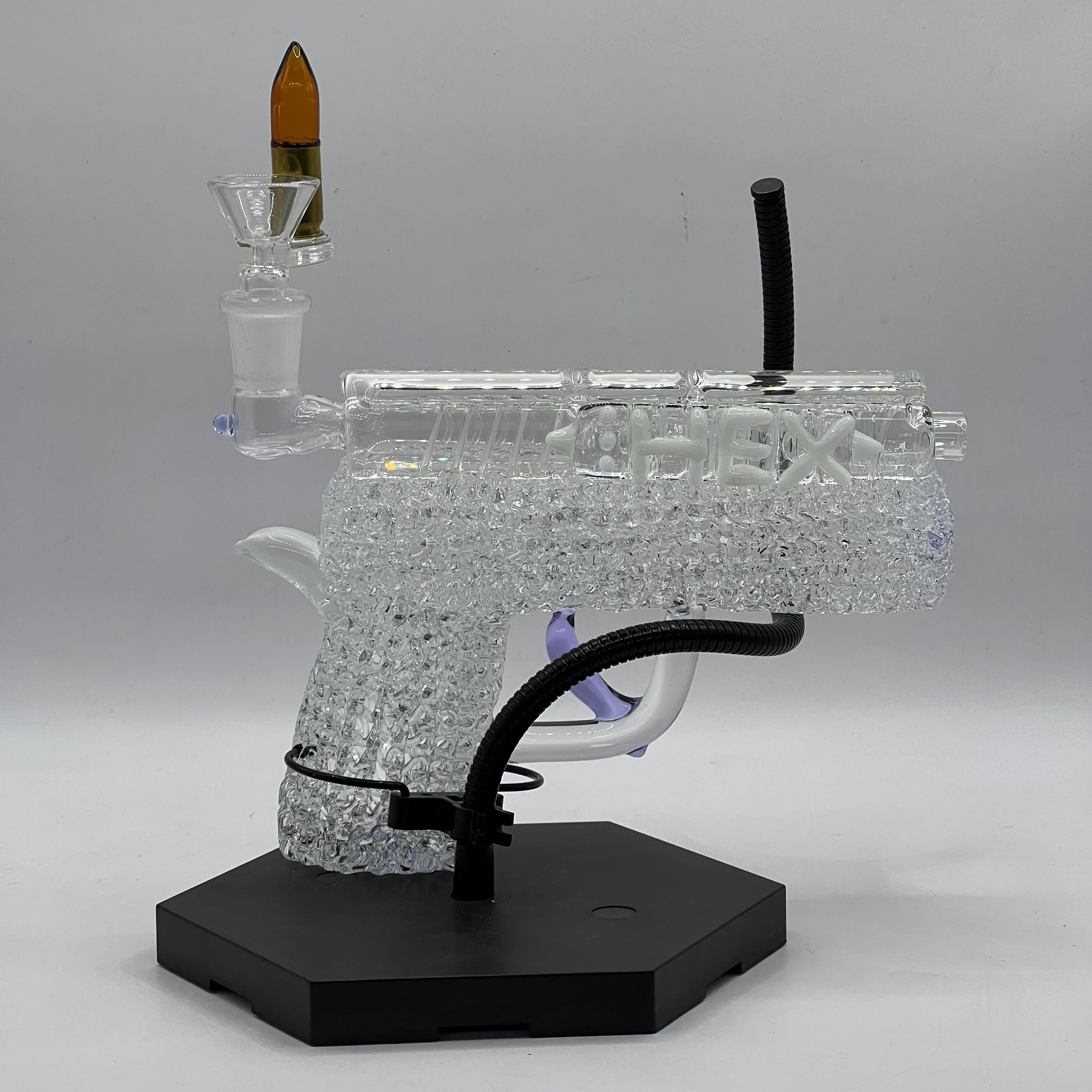 Opposite profile of OTG Glass collector handgun pipe showcasing sculpted slide, textured grip, and crystal-clear borosilicate craftsmanship.