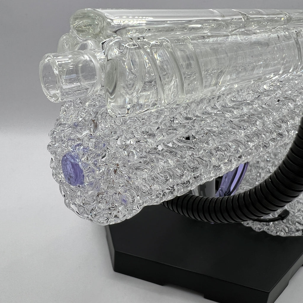 Close-up of the sculpted slide and precision glass detailing on the OTG Glass .45 caliber handgun pipe.