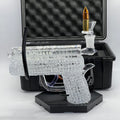 OTG Glass custom .45 caliber handgun pipe featuring intricate clear chaos texture with removable glass cartridge bowl and protective hard case.