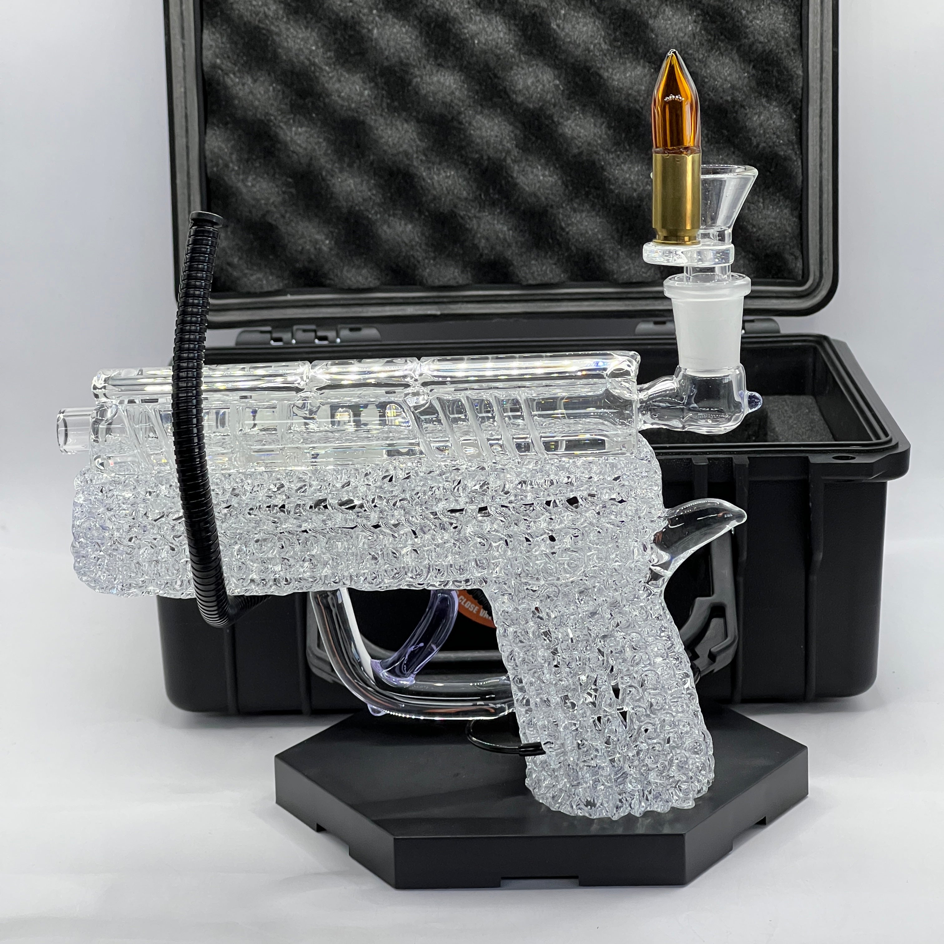 OTG Glass custom .45 caliber handgun pipe featuring intricate clear chaos texture with removable glass cartridge bowl and protective hard case.