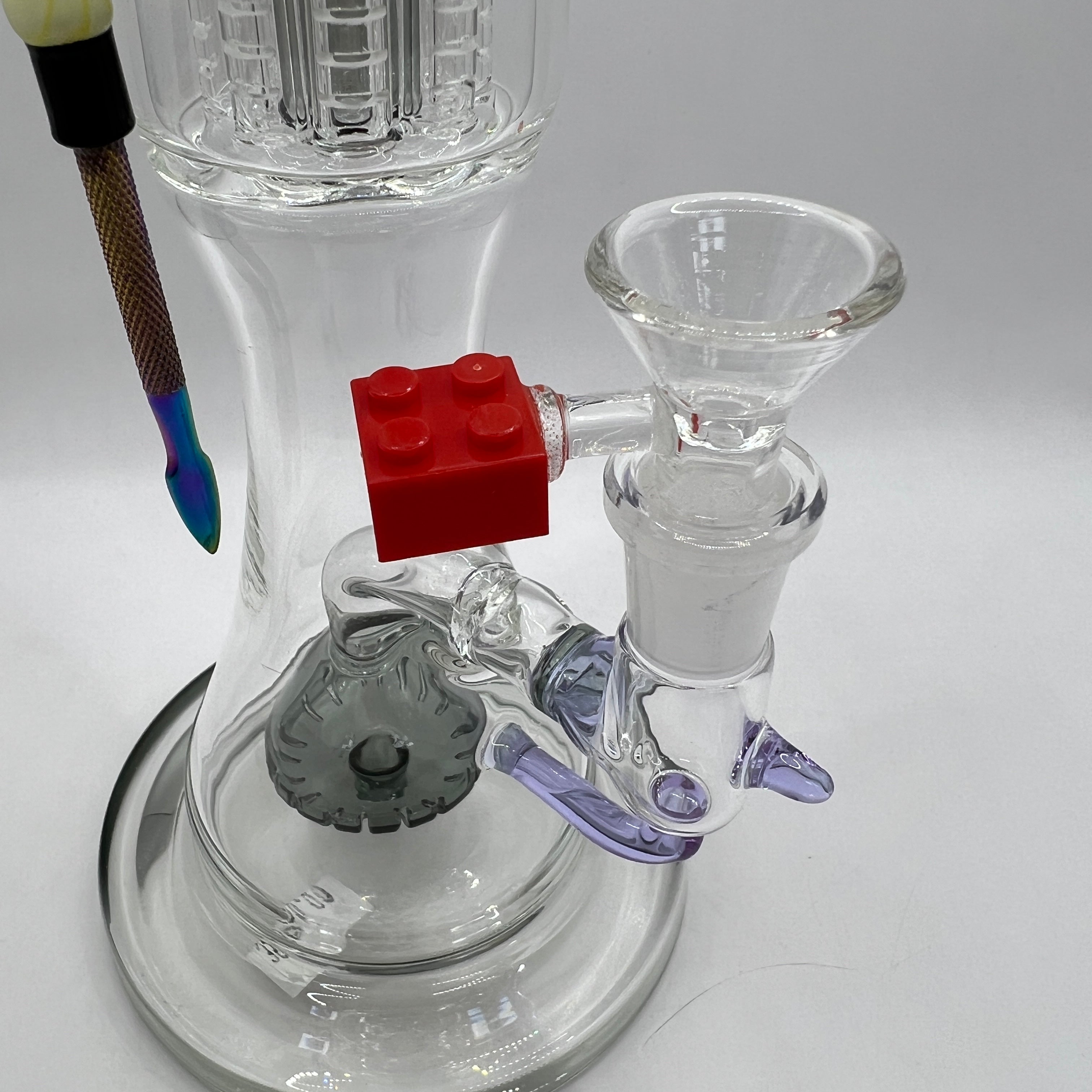 Close-up of LEGO-style bowl and lower dome percolator on Iron Man water pipe