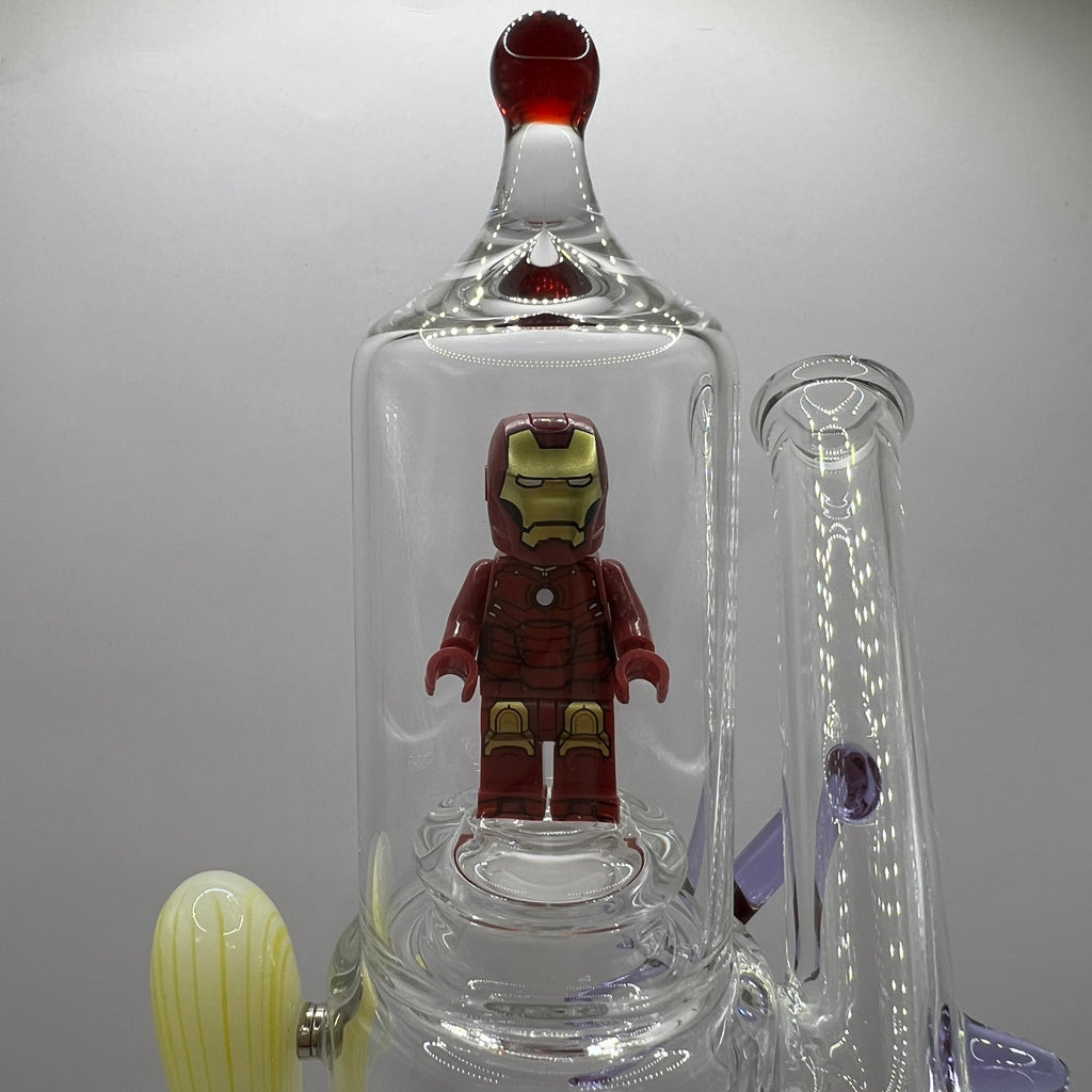 Close-up of Iron Man figurine enclosed inside the upper glass chamber