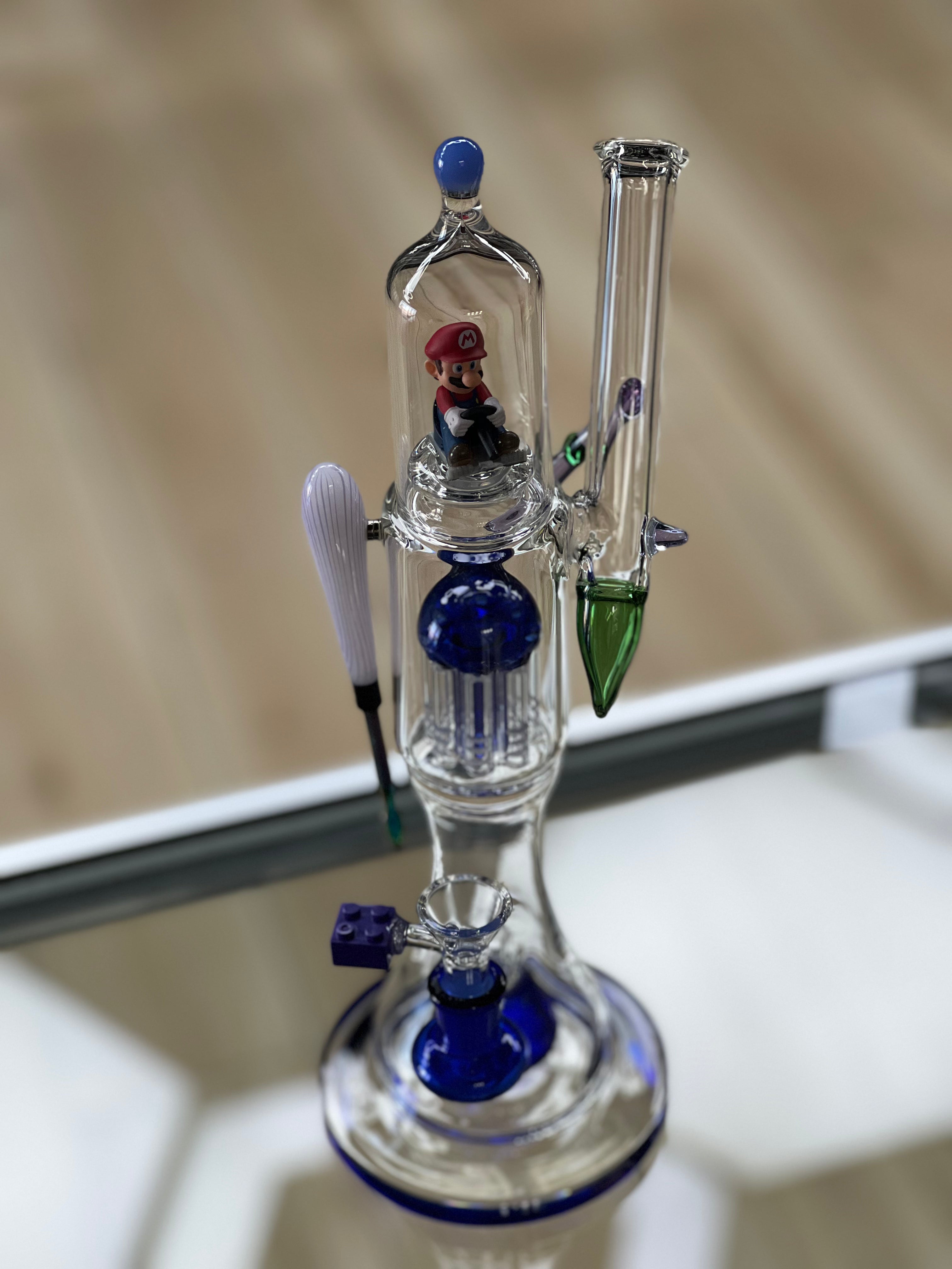 the otg glass custom mario themed water pipe displayed at hex smoke shop