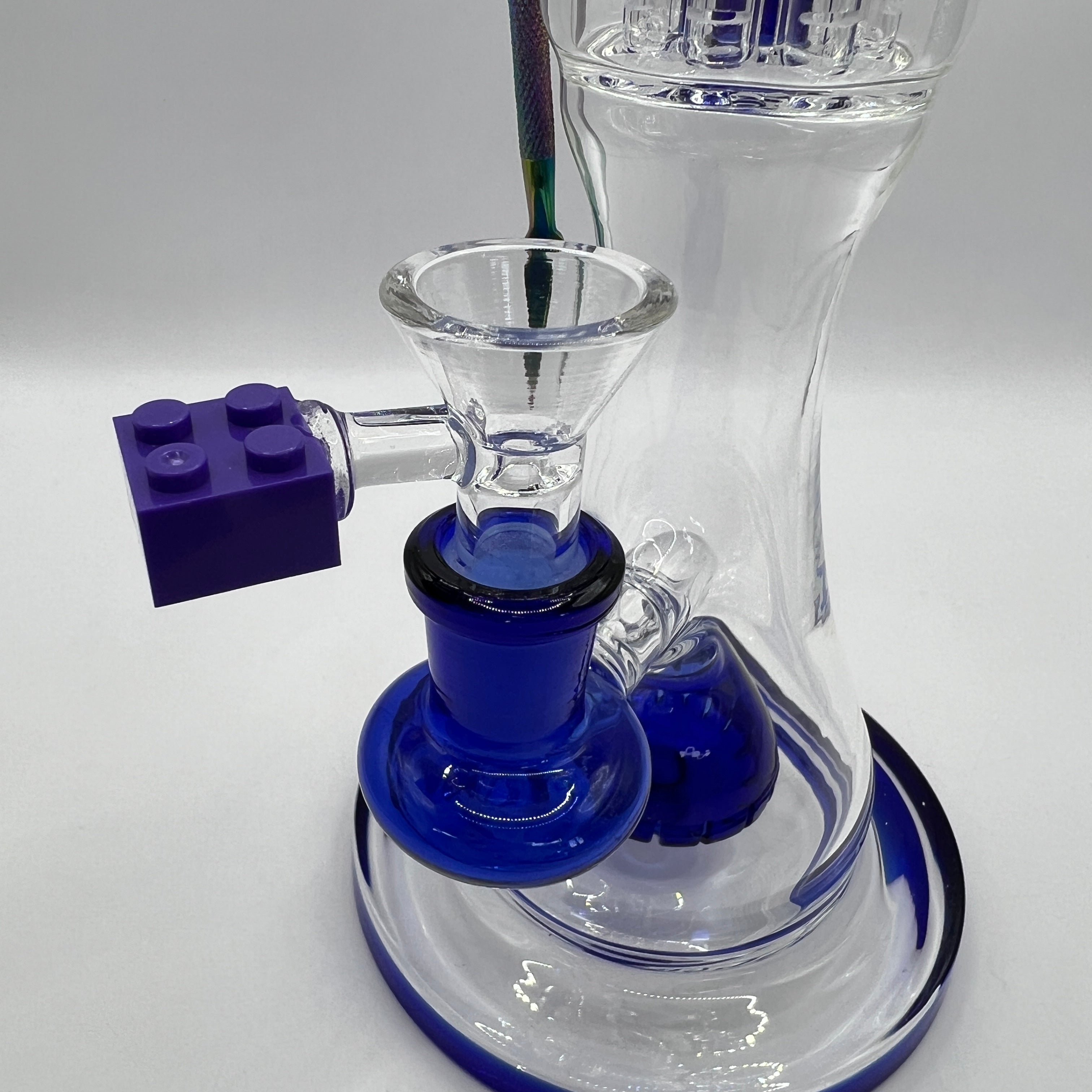 Close-up of LEGO-style bowl handle and blue glass joint