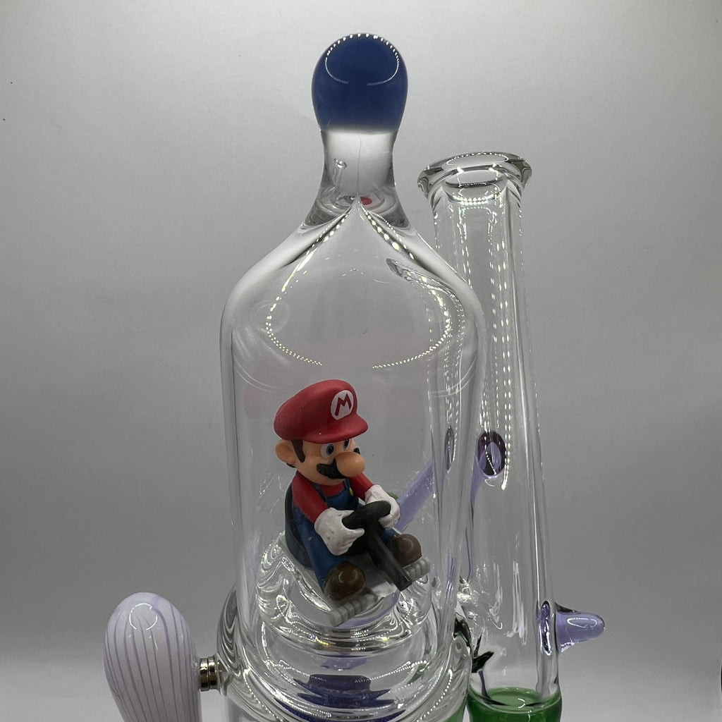 Front close-up of Mario figure enclosed inside the OTG Glass water pipe