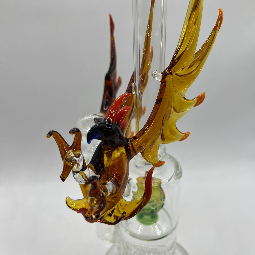 Handcrafted amber phoenix sculpture with spread wings on OTG Glass water pipe