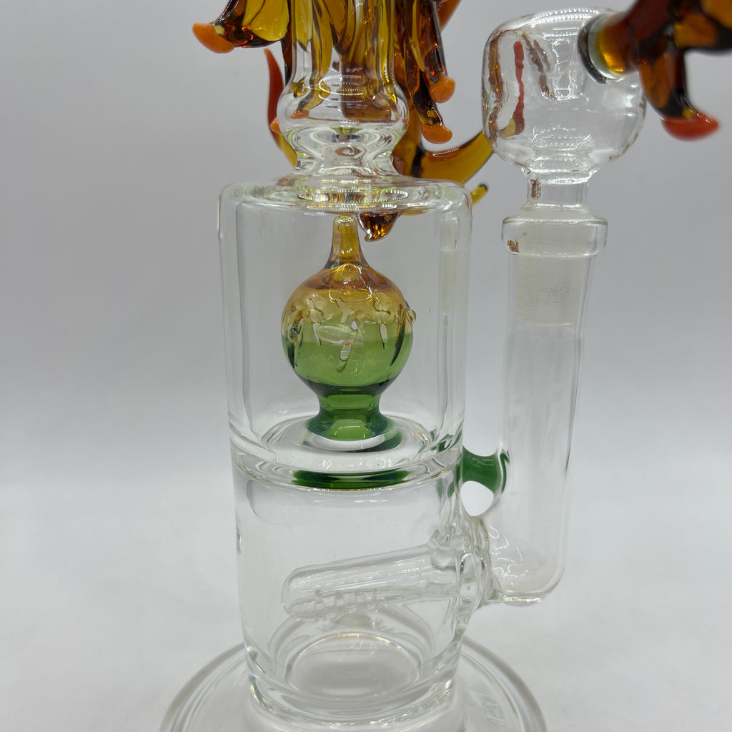 Close-up of green upper percolator inside handcrafted OTG Glass Phoenix water pipe