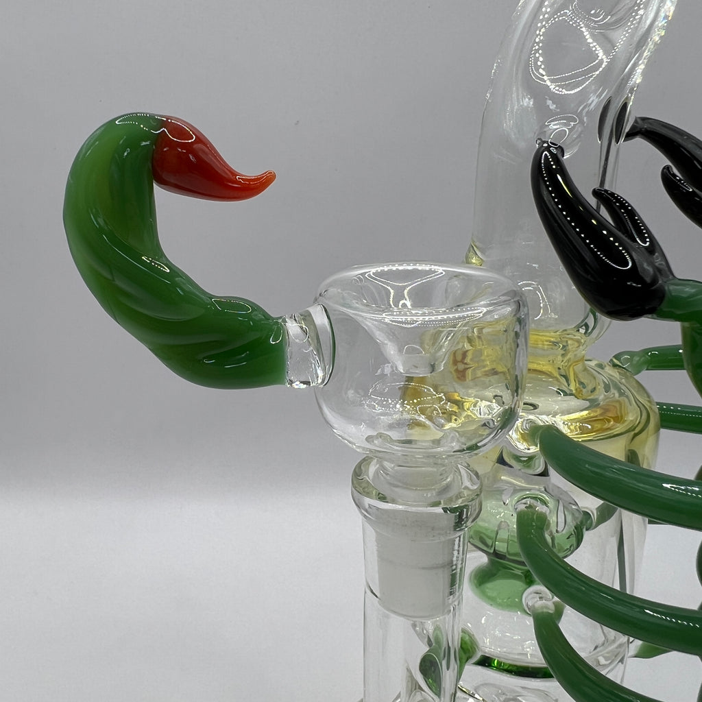 Close-up of matching green scorpion stinger bowl for OTG Glass water pipe