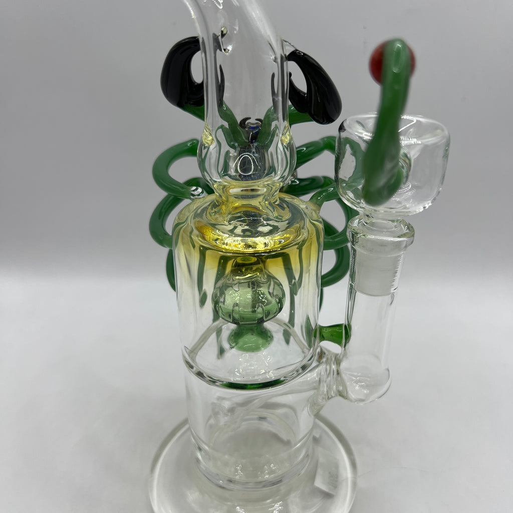 Angled view of handcrafted OTG Glass scorpion water pipe with custom borosilicate artwork