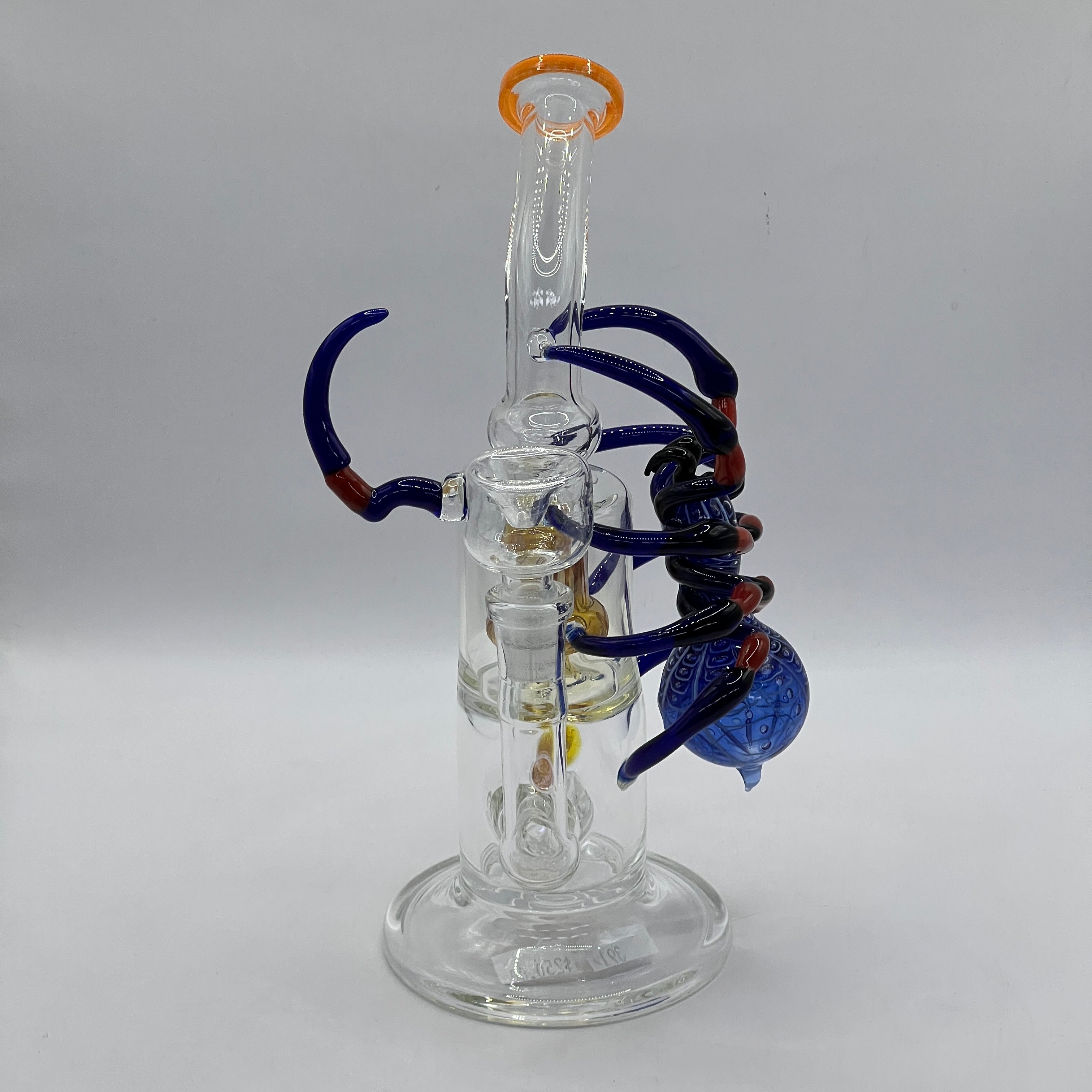 Front view showing amber showerhead percolator inside OTG Glass spider water pipe