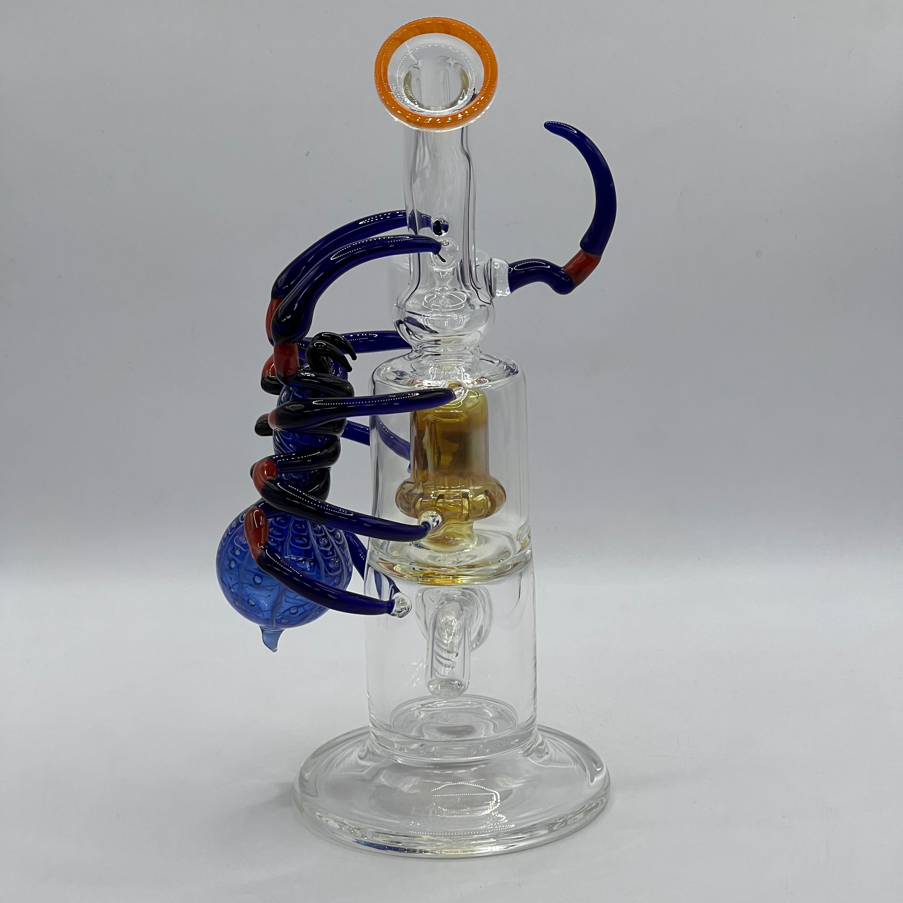 Rear angle of handcrafted OTG Glass spider bong with wrapped sculpted legs and premium borosilicate construction