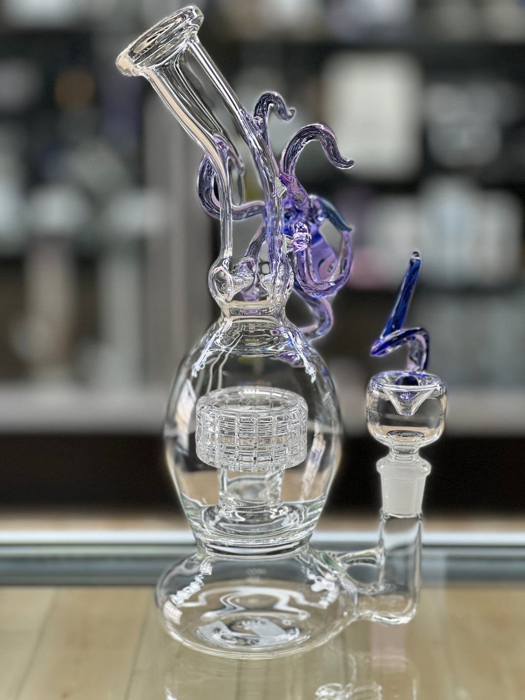 angled pic of the otg glass squid water pipe at hex smoke shop