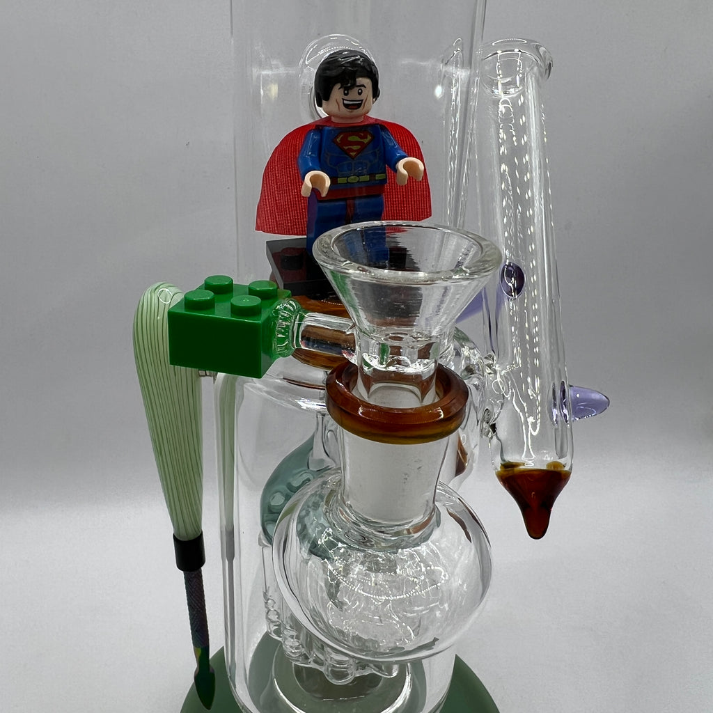 Close-up of the custom LEGO-inspired Superman bowl and magnetic steel packing tool.