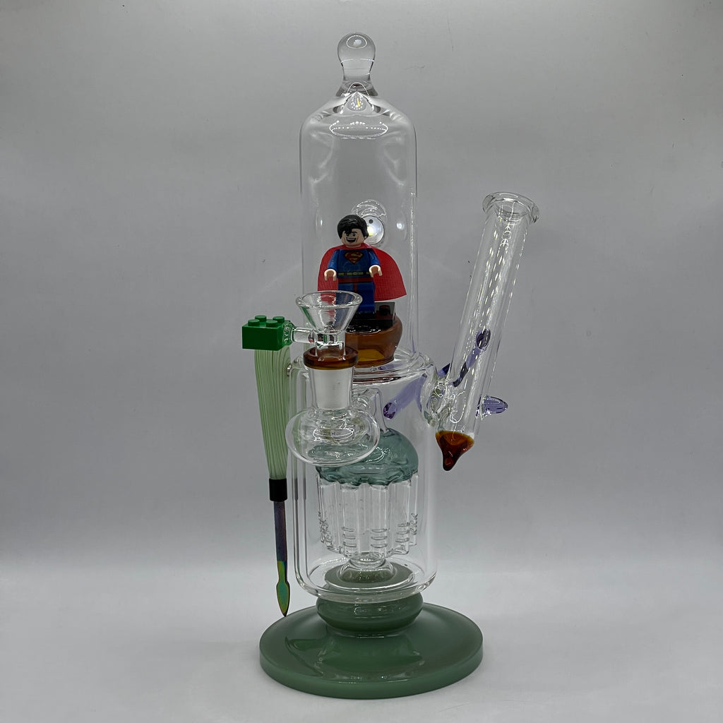 Front angle of handcrafted OTG Glass Superman collector water pipe.