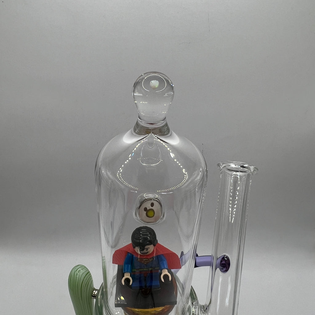 Superman LEGO figure displayed inside the illuminated glass chamber with genuine opal accent.