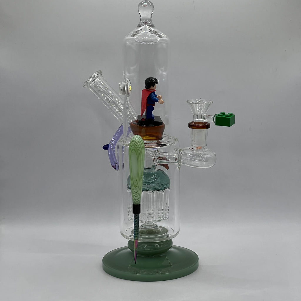 OTG Glass Superman themed water pipe with LED display chamber, tree percolator and magnetic tool.