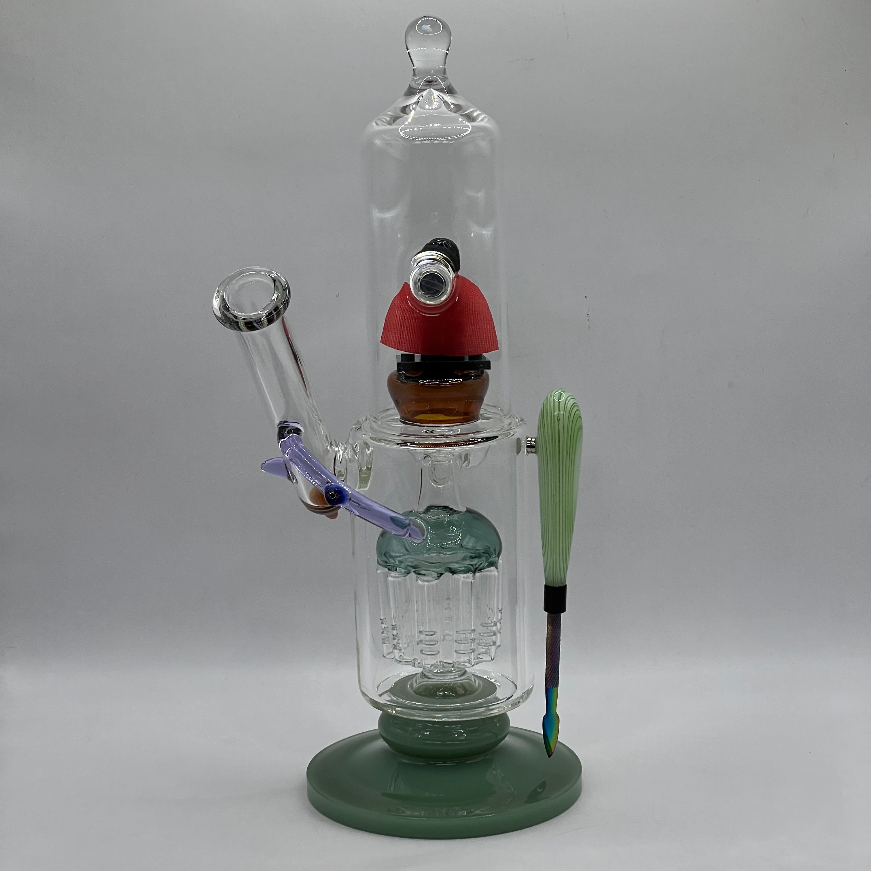 Rear angle of OTG Glass Superman themed water pipe highlighting the illuminated chamber.