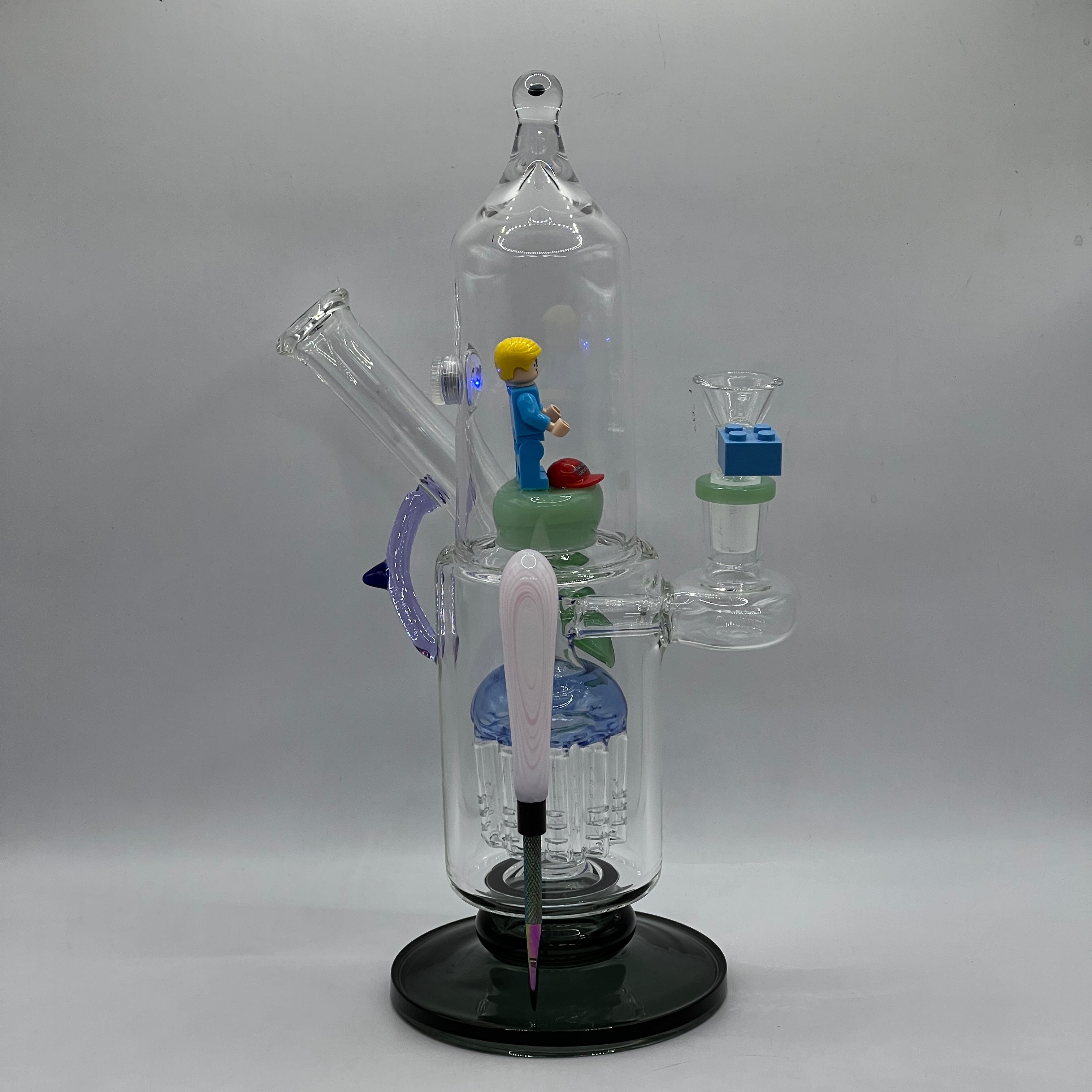 OTG Glass Trump themed water pipe with LEGO-style bowl and enclosed character figurine