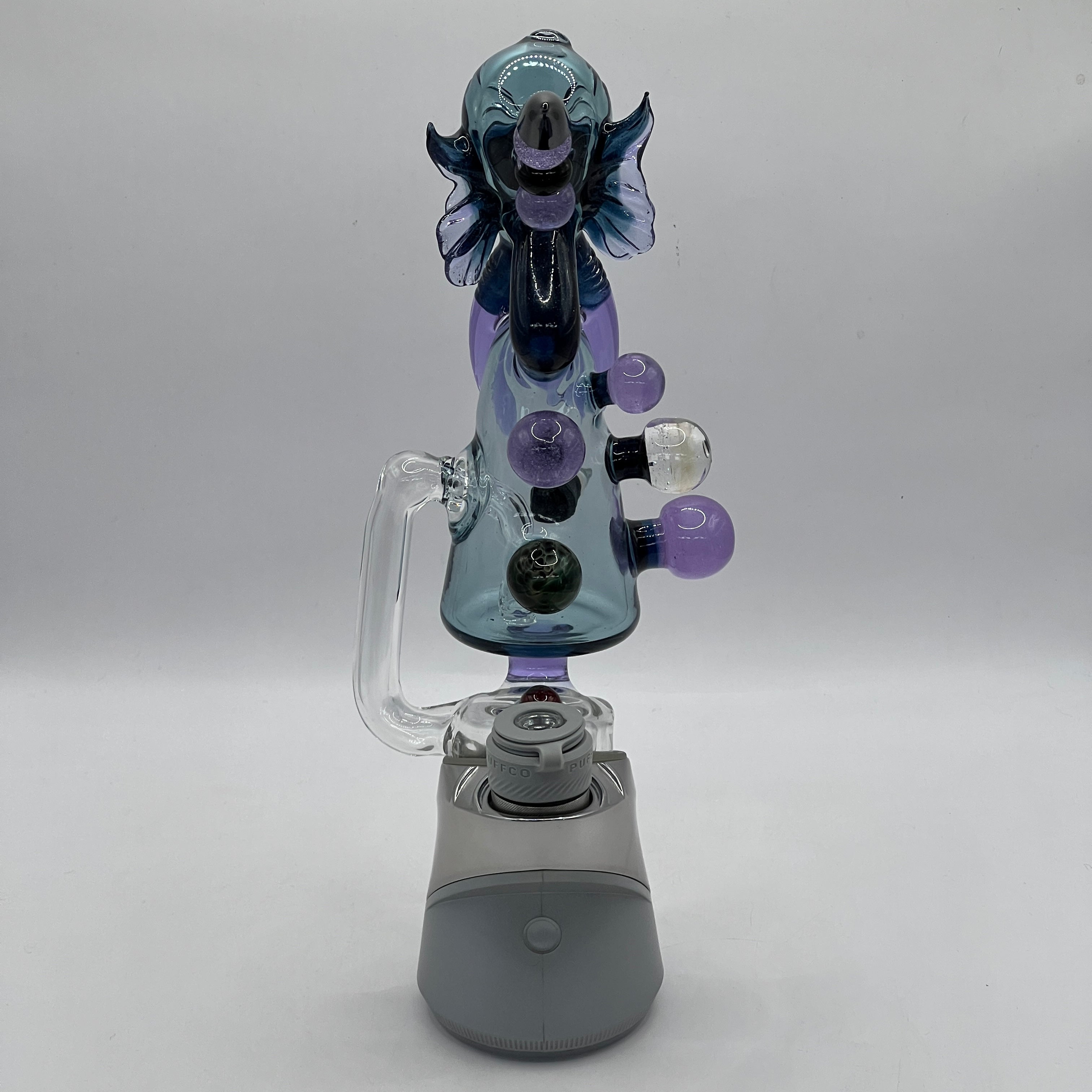 Rear view of Merc Glass Cthulhu Puffco attachment with marble accents