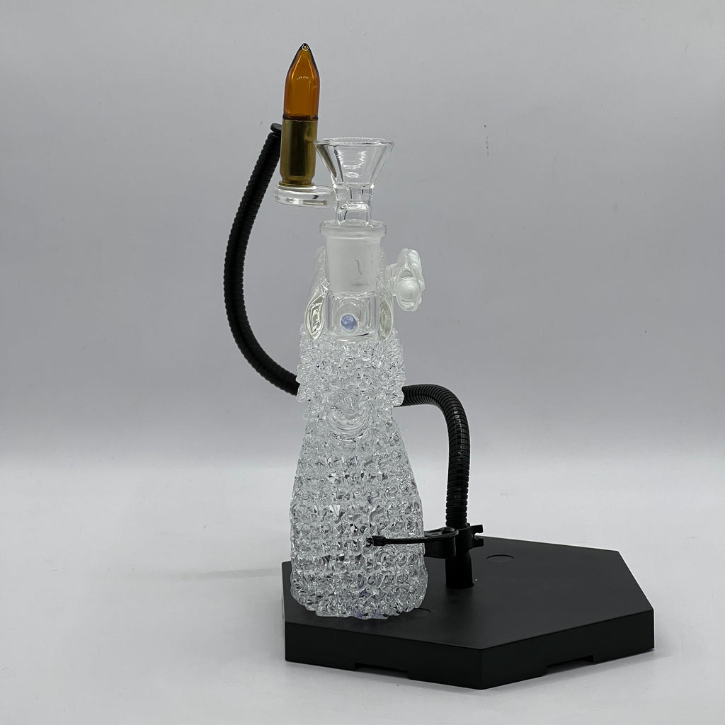 Rear angle of handcrafted OTG Glass handgun pipe displaying detailed glasswork, purple accents, and ergonomic grip design.