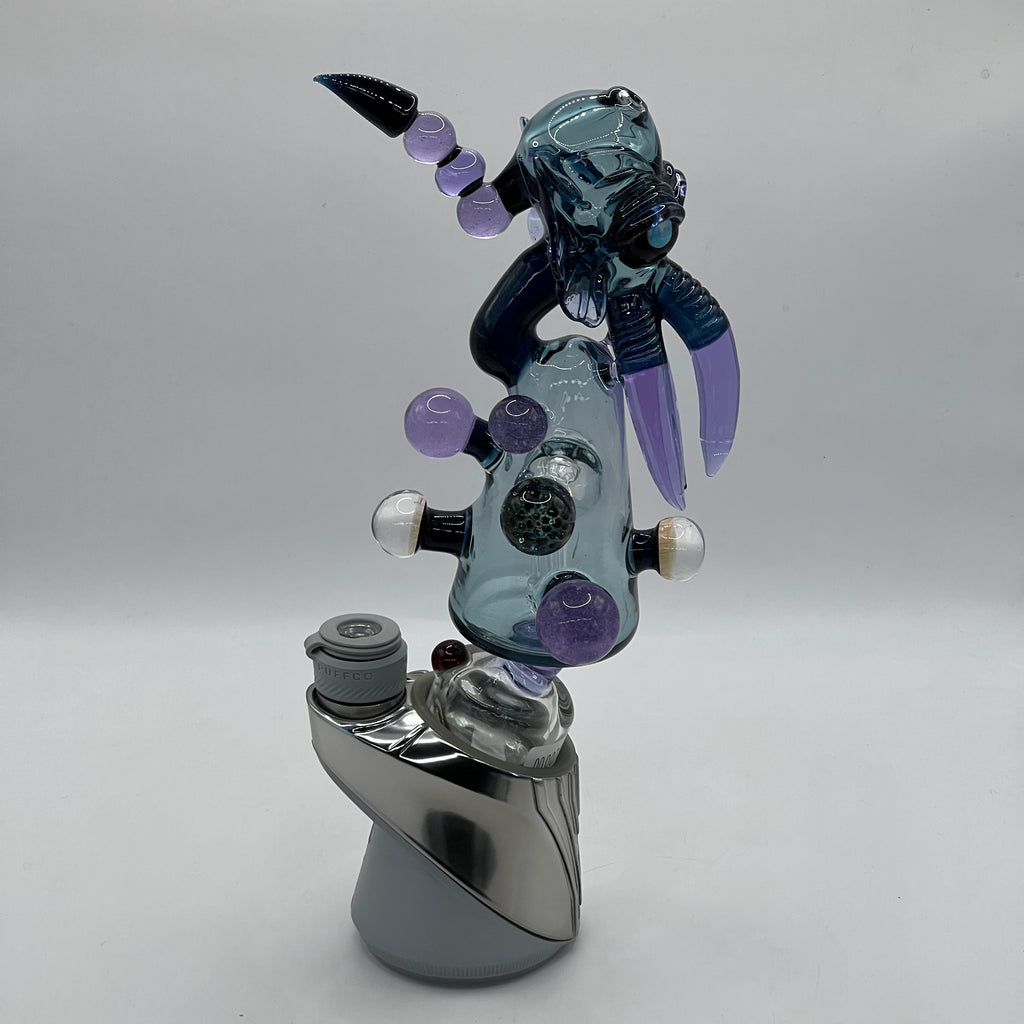 Angled view of Merc Glass Cthulhu Puffco collector attachment
